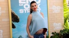 Anne Hathaway pokes fun at ‘fake baby bump’ theories
